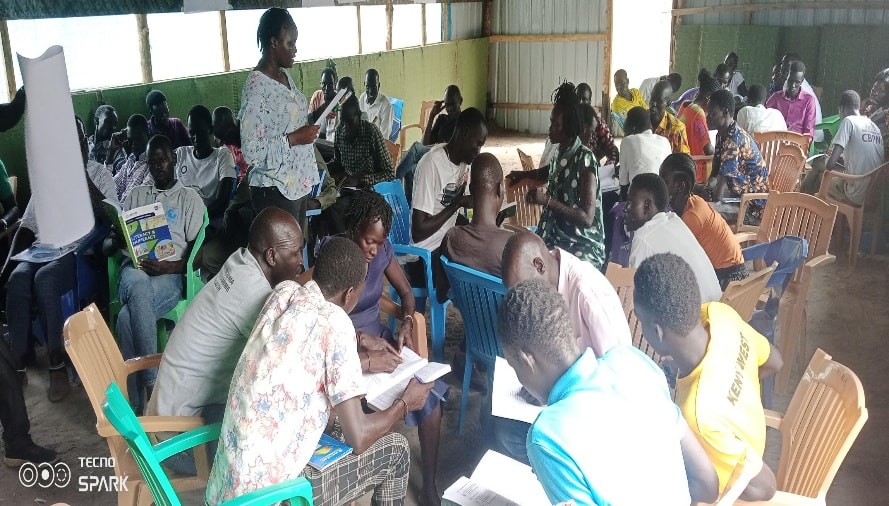 Master trainers and facilitators at the close of a TOT session, April 2023.